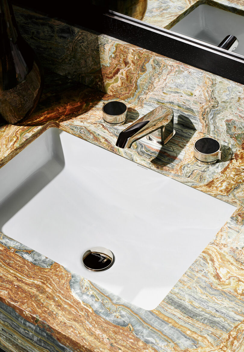 multicolored marble sink surround with chrome fixtures