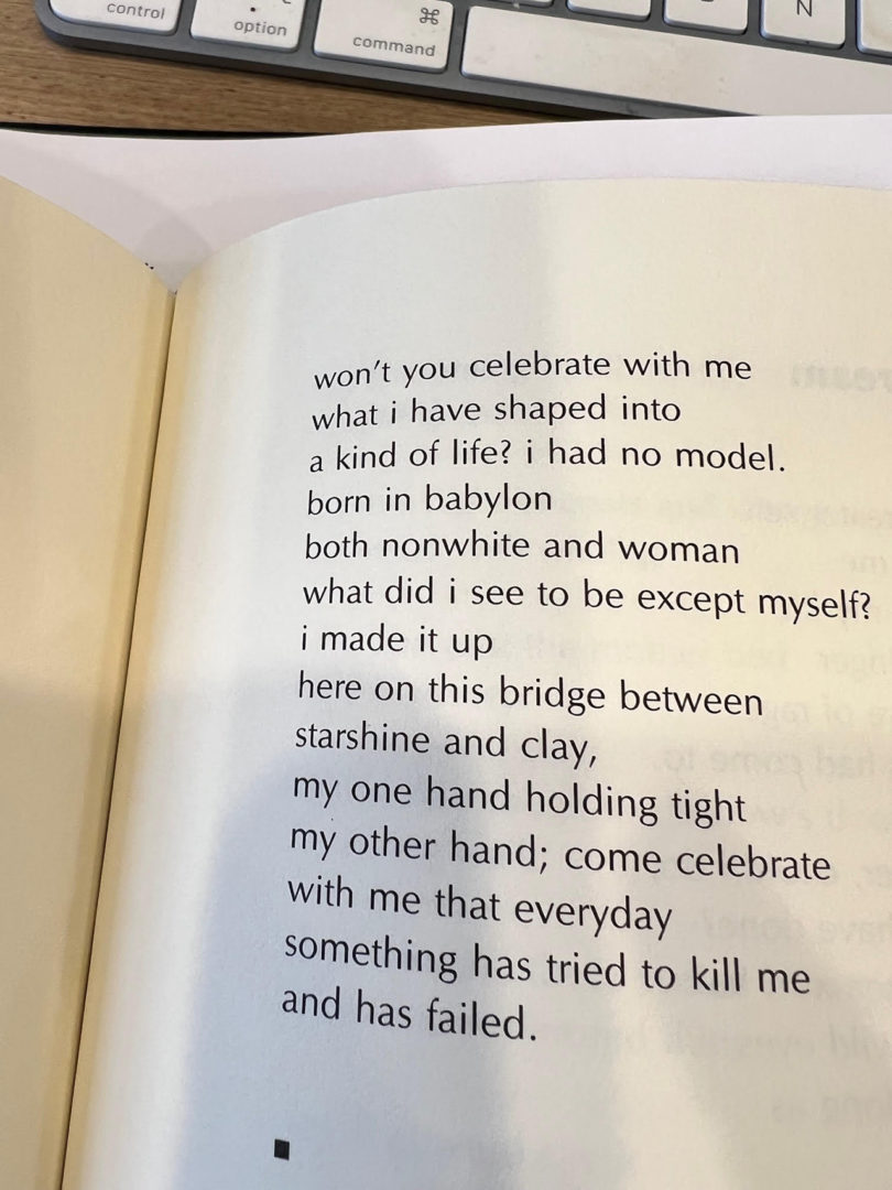 book opened to a page with a poem