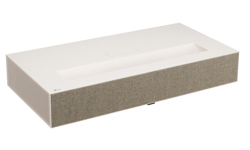 LG CineBeam short throw projector with an off-white case, ridged sides and beige fabric speaker front set against white background.