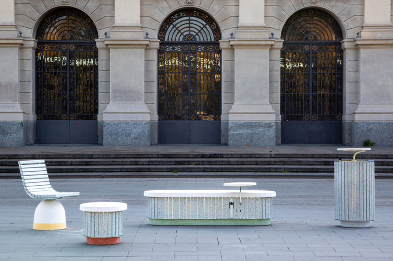 four-piece collection of cement outdoor furniture