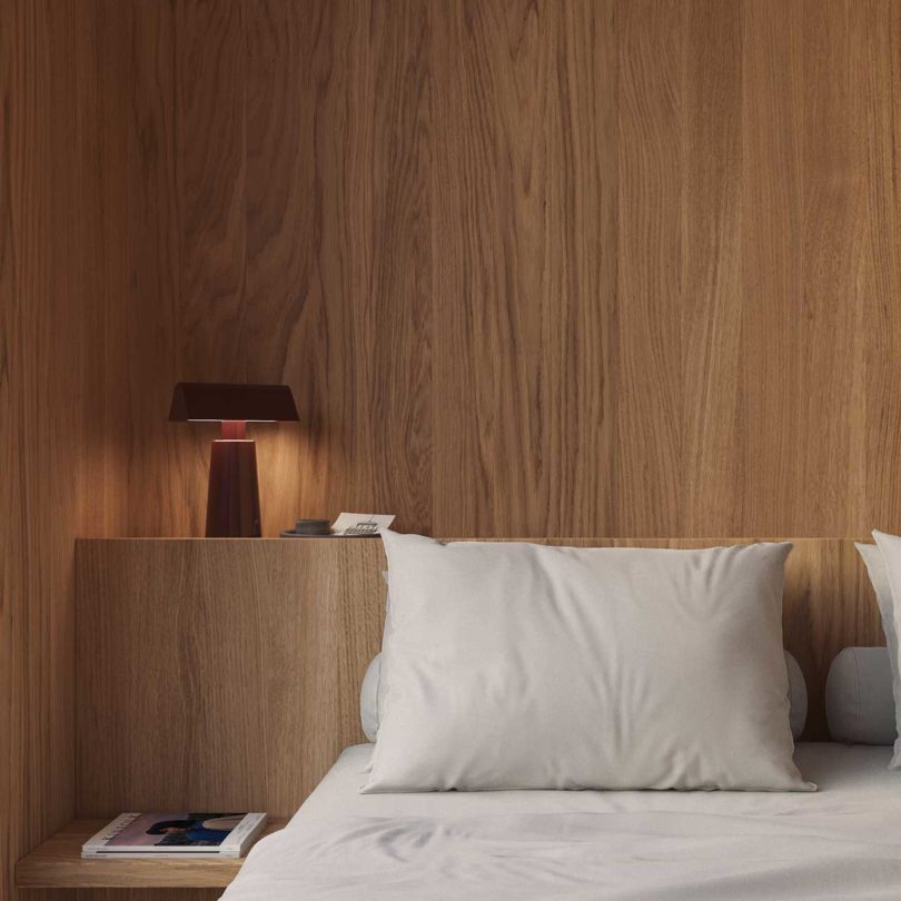 partial view of modern bedroom with wood paneling