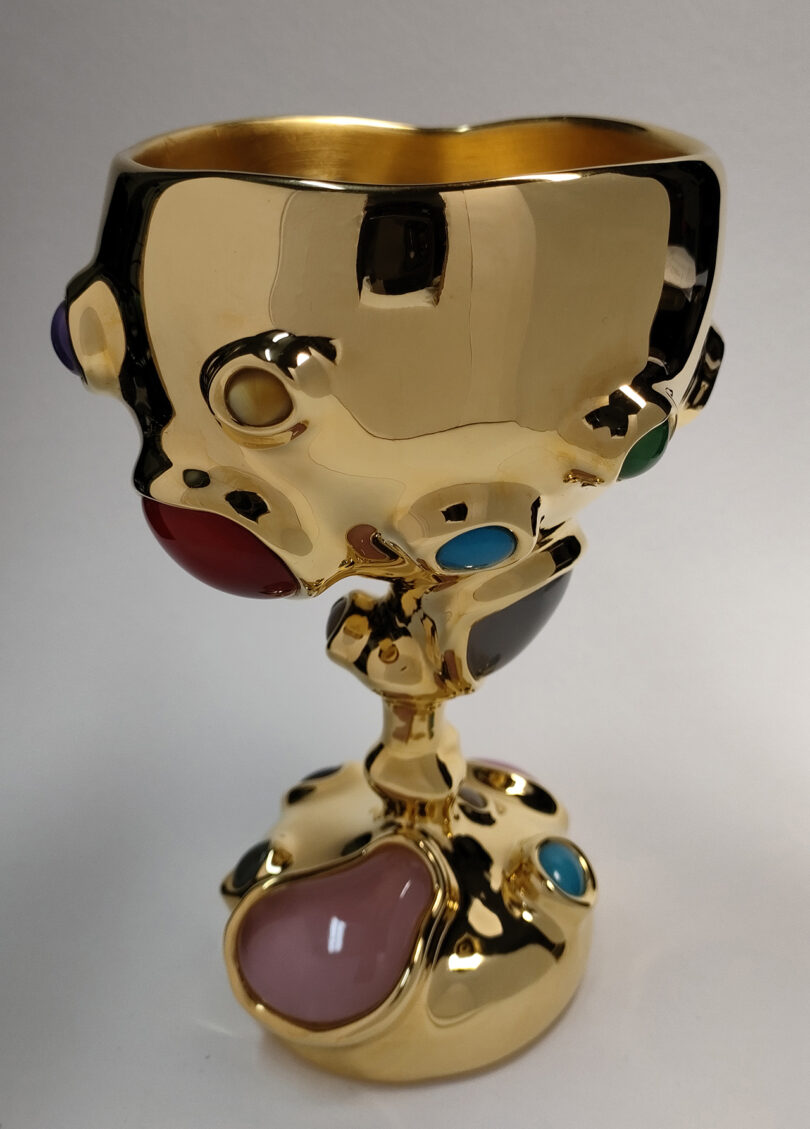 gold chalice studded with colorful gems