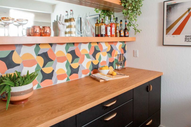 interior view of renovated wet bar in basement with colorful tile
