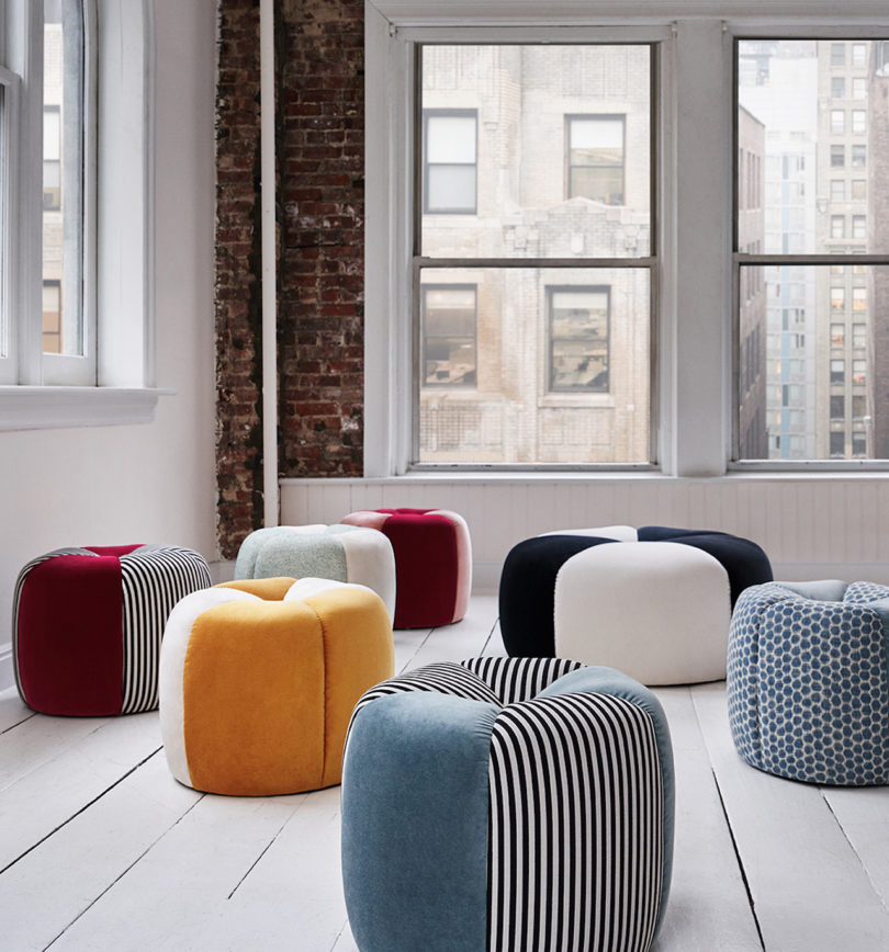 styled interior space with multicolored poufs and ottomans