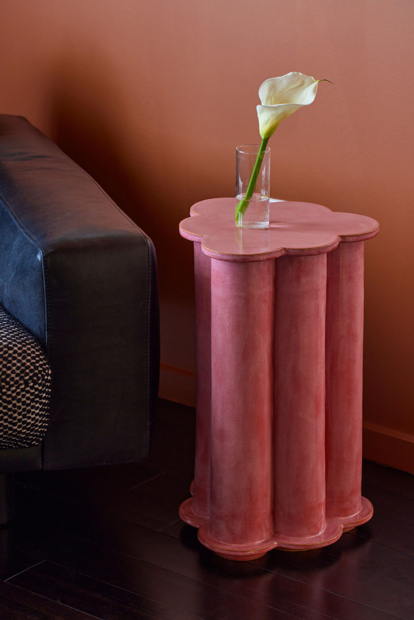 bubblegum pink side table resembling a modern column in a styled living space