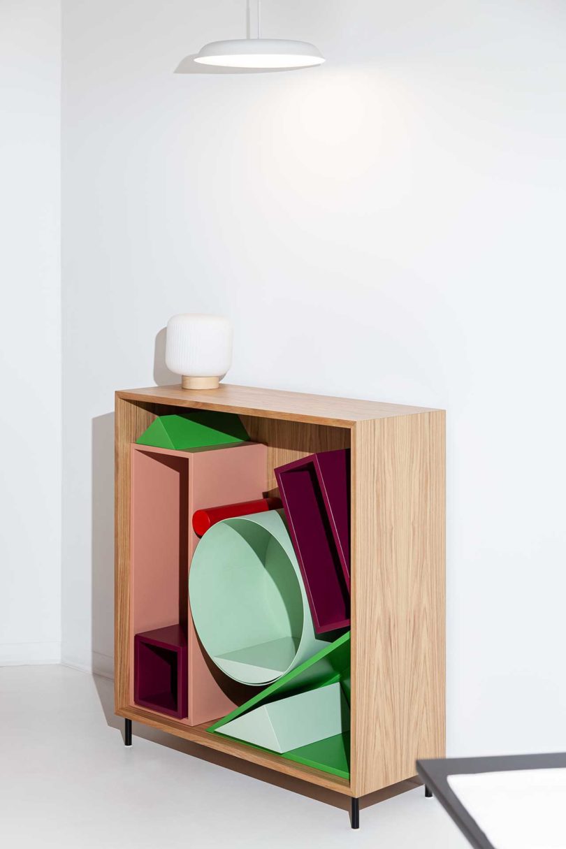 modular storage shelf with colorful geometric boxes inside