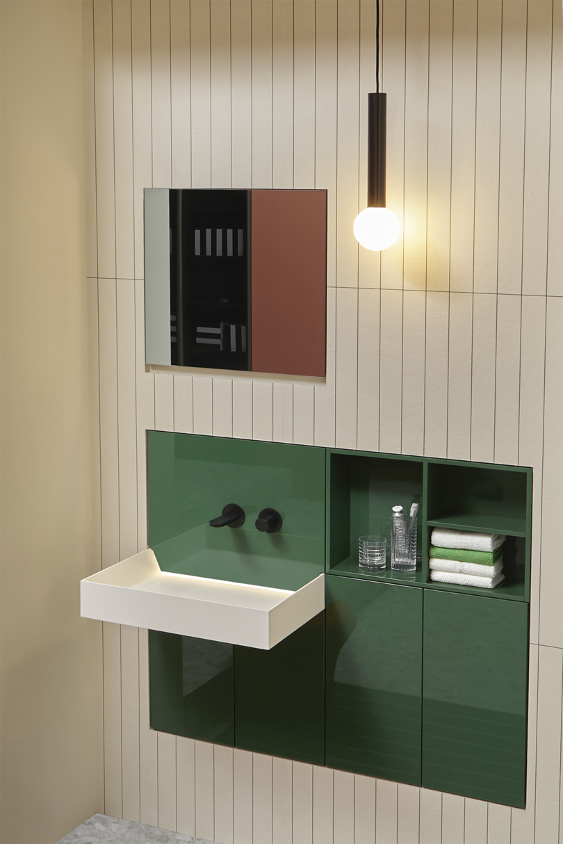 modern bathroom with small modular dark green vanity