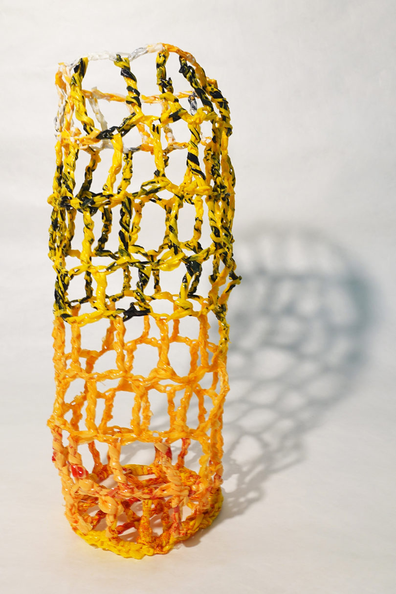 yellow and orange abstract vessel made using recycled plastic bags