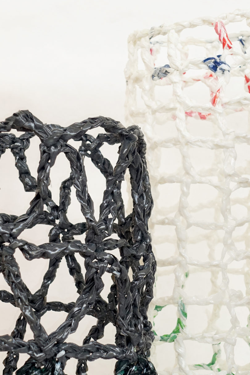 detail of white and black abstract vessels made using recycled plastic bags