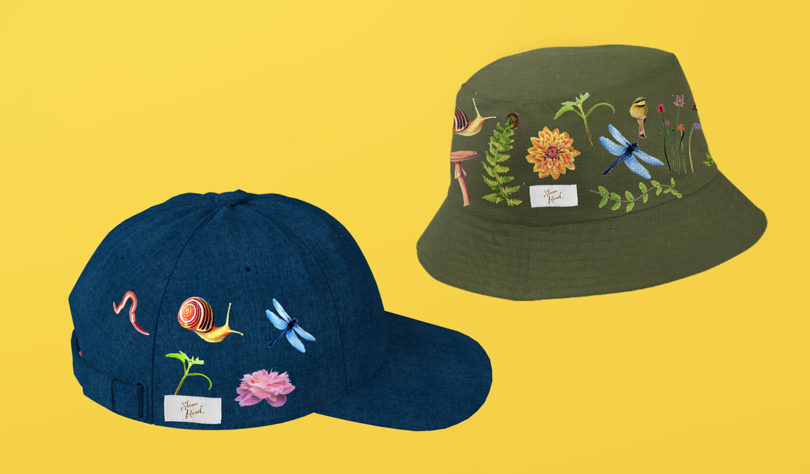 Stone Road dark blue baseball cap and bucket hat with embroidered patches with nature imagery attached onto their sides.
