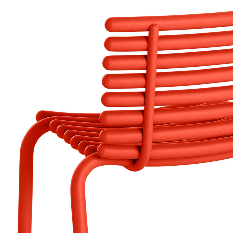 detail of modern red outdoor chair on white background