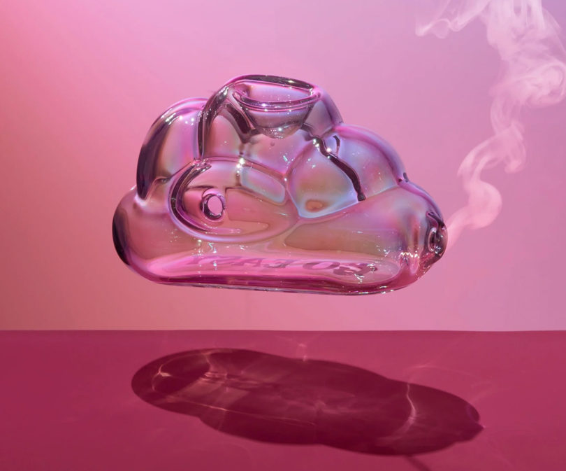 Go Easy Smoking Glass shaped like a cloud and floating with smoke coming out of it against magenta background.