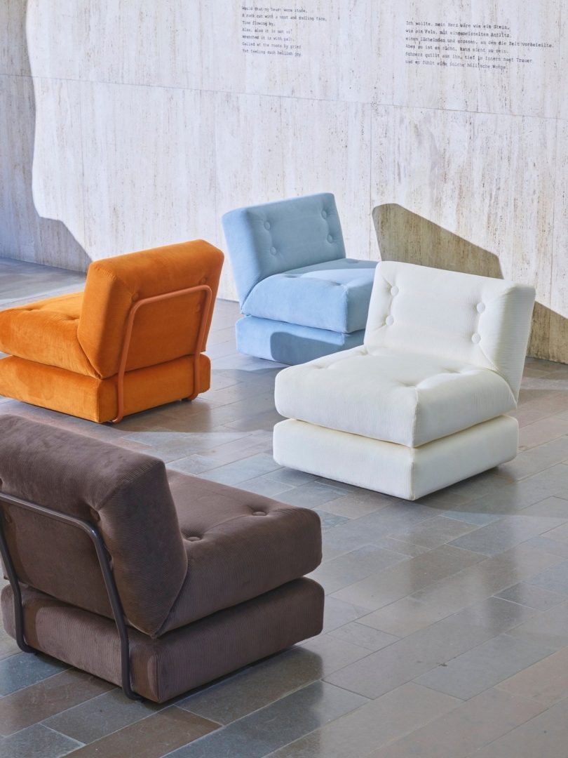 brown orange white and blue arm chairs