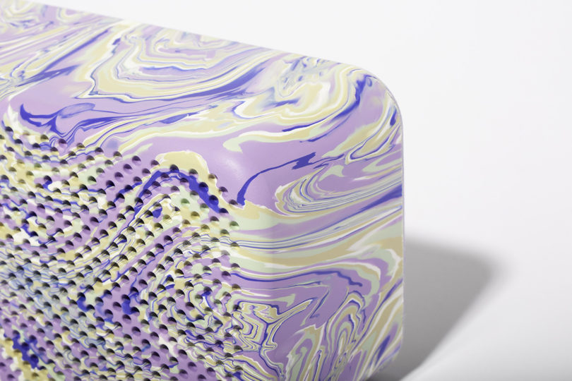 Corner detail of Gomi collection one Bluetooth speaker in Ultraviolet colorway.