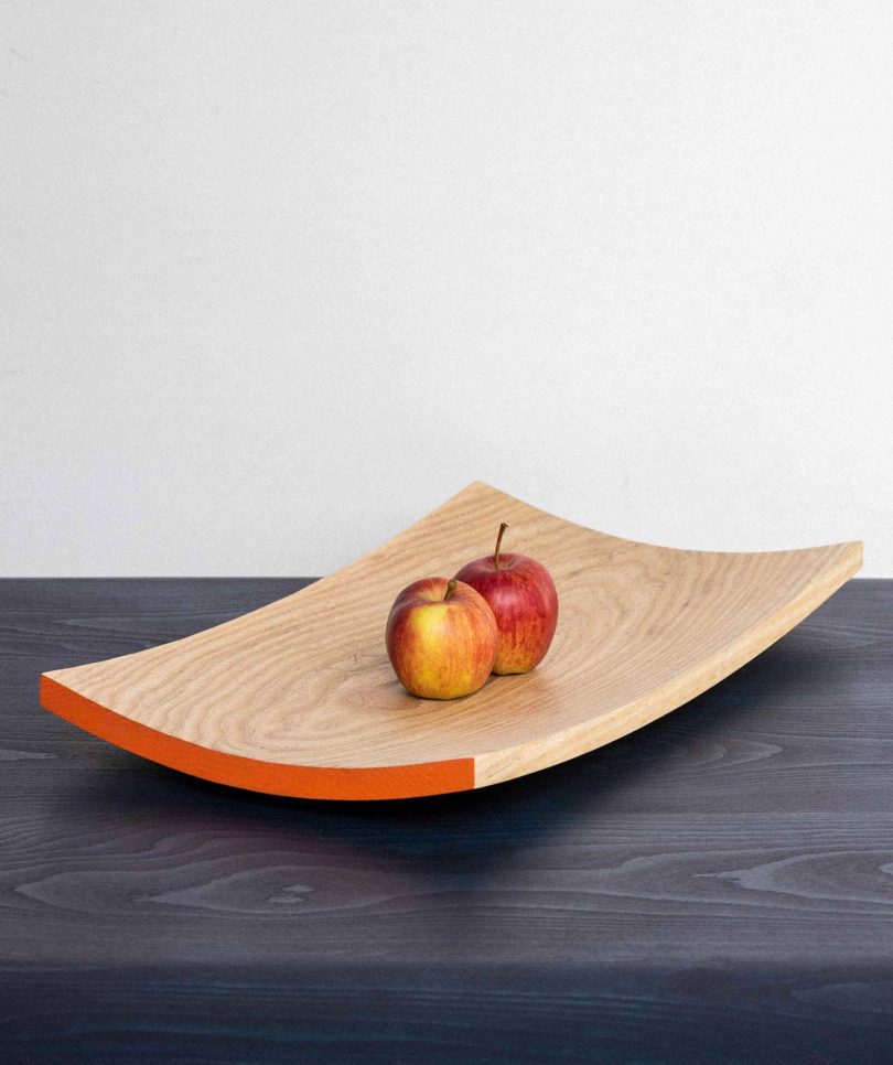 wooden fruit bowl with apples inside