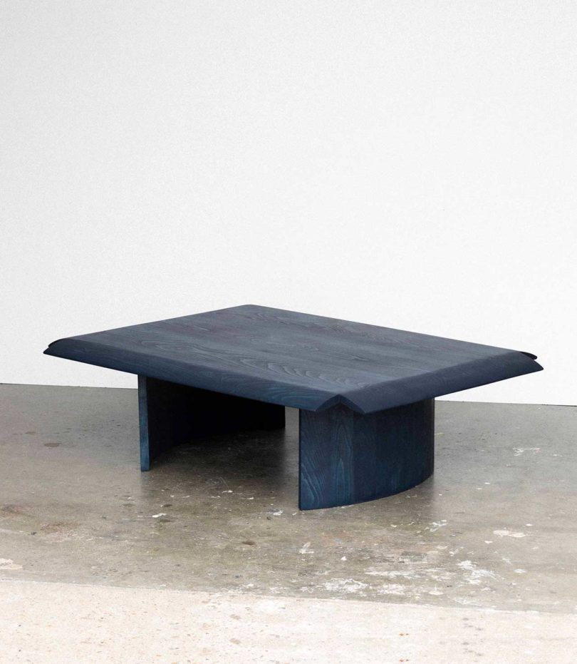 blue coffee table with tipped-down edges