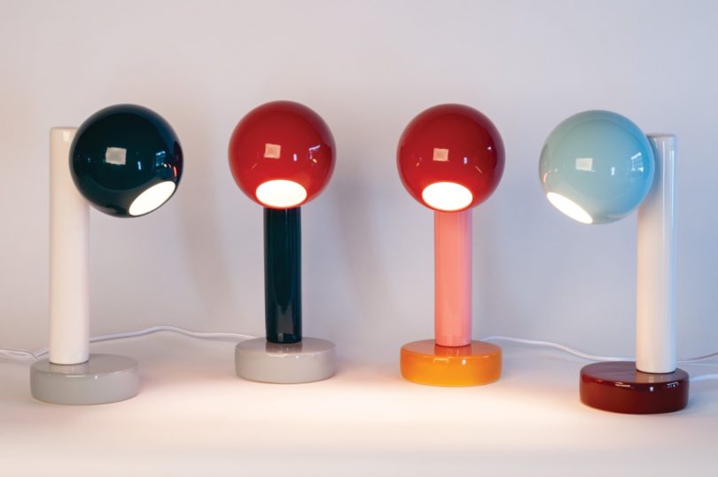 four colorful desk lamps turned on