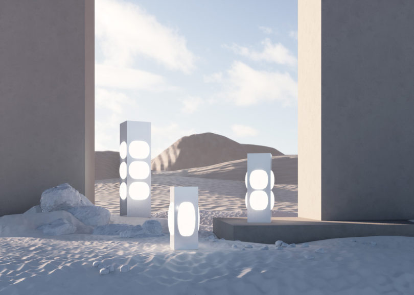 three floor lamps in the sand