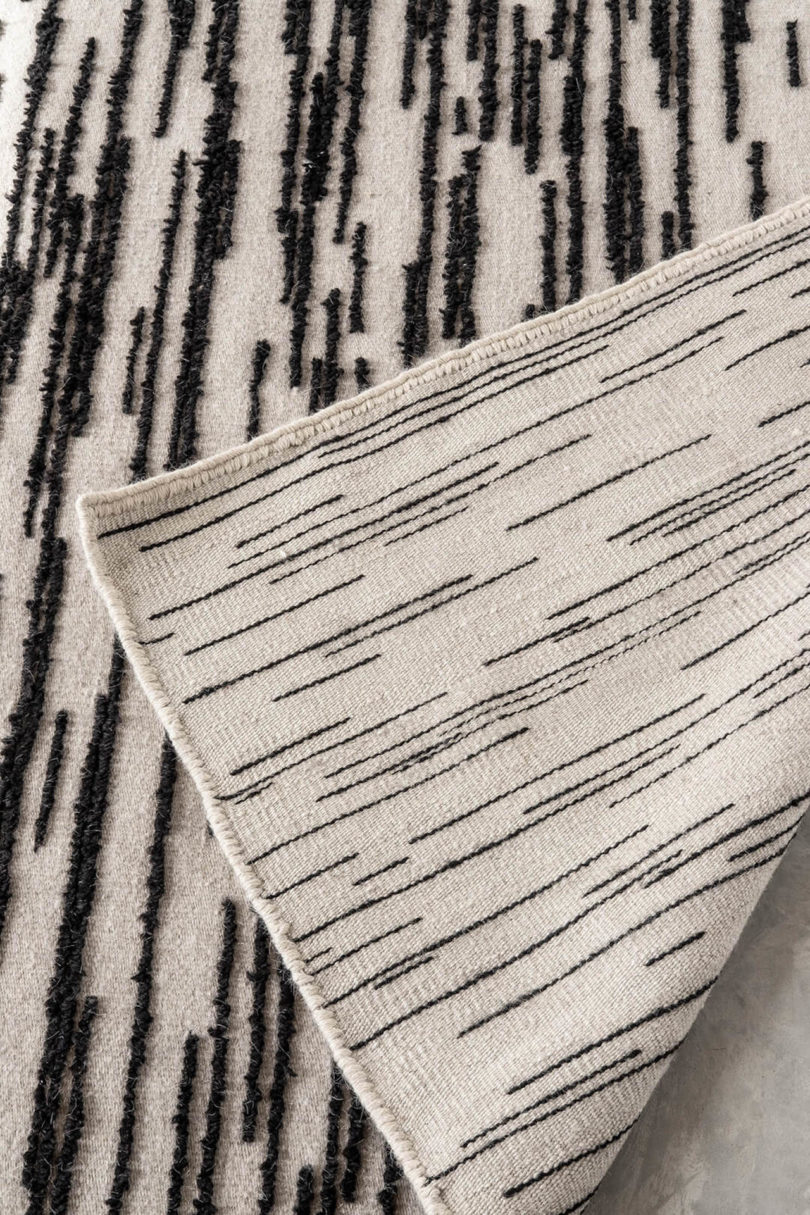 close-up of ivory and black rug