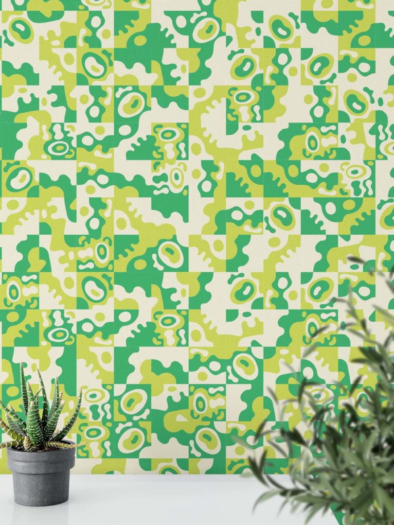 abstract maximalist green wallpaper next to plants