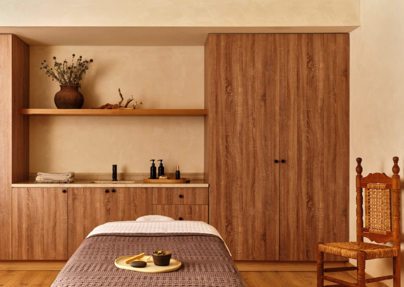 Spa treatment area with neutral tones and massage bed