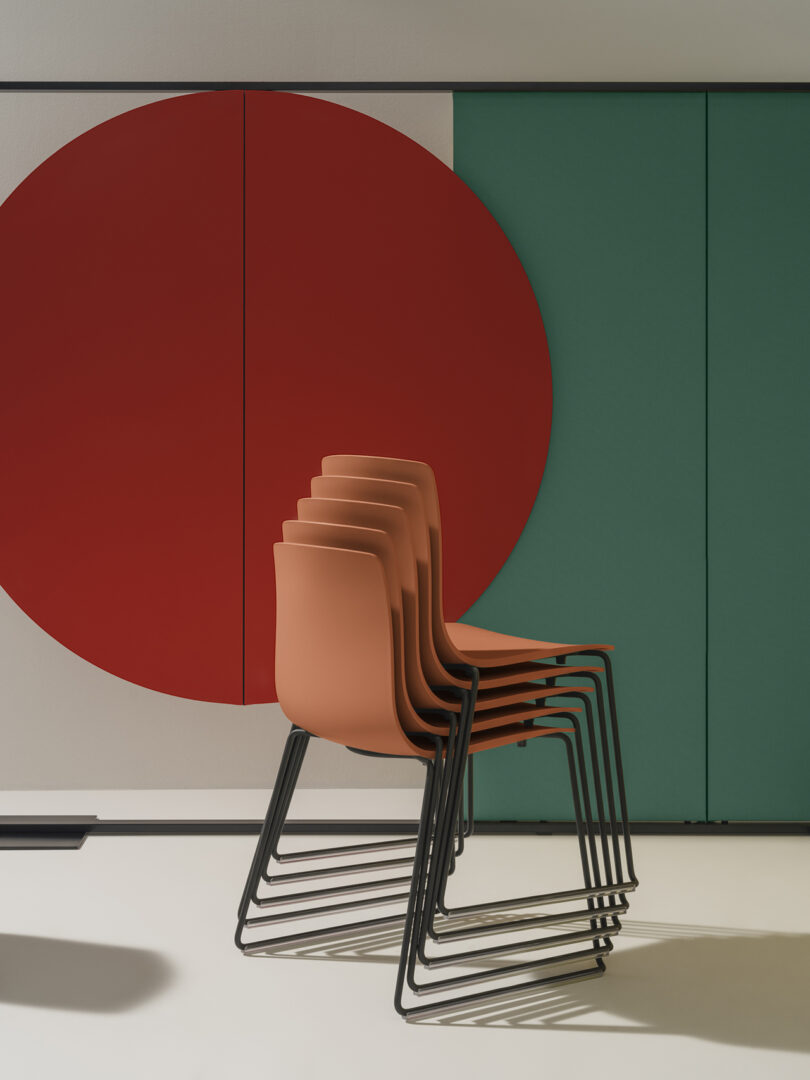 coral colored stacked office chairs