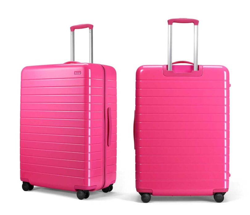 two side by side neon pink suitcase, one at angle one from back
