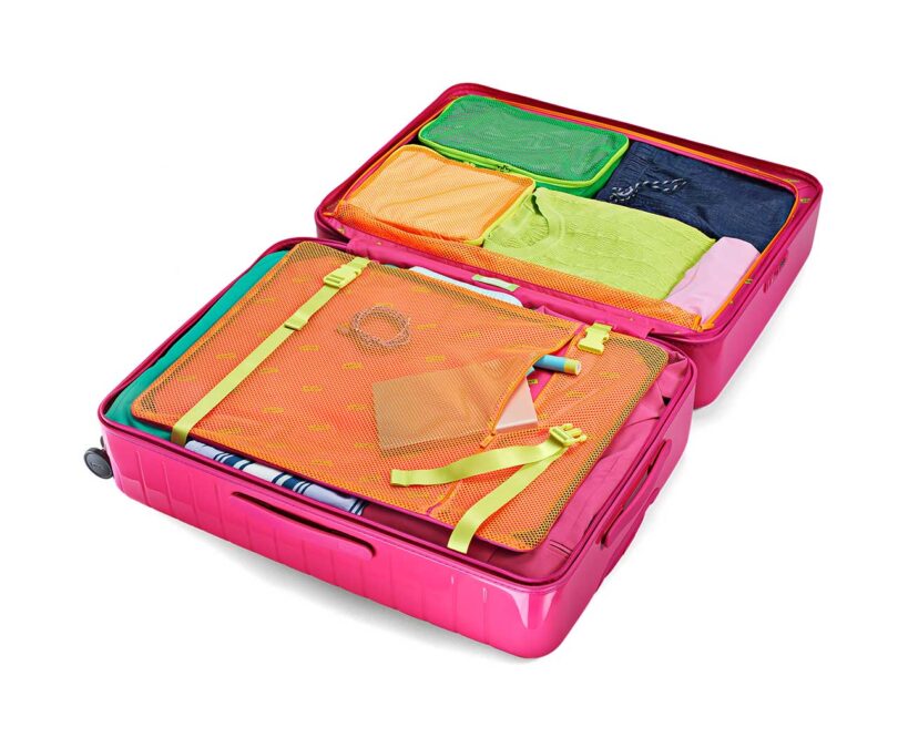 neon pink suitcase open with neon packing cubes