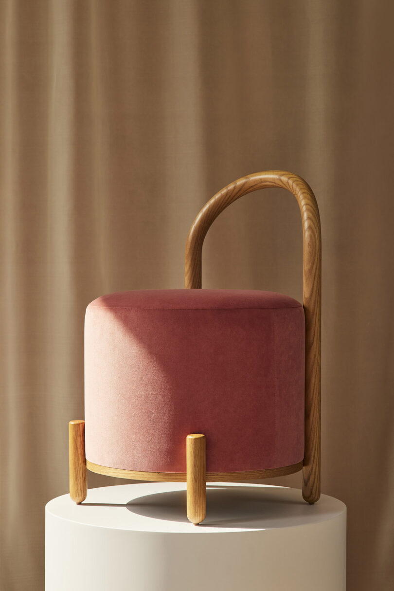 side of dark pink pouf stool