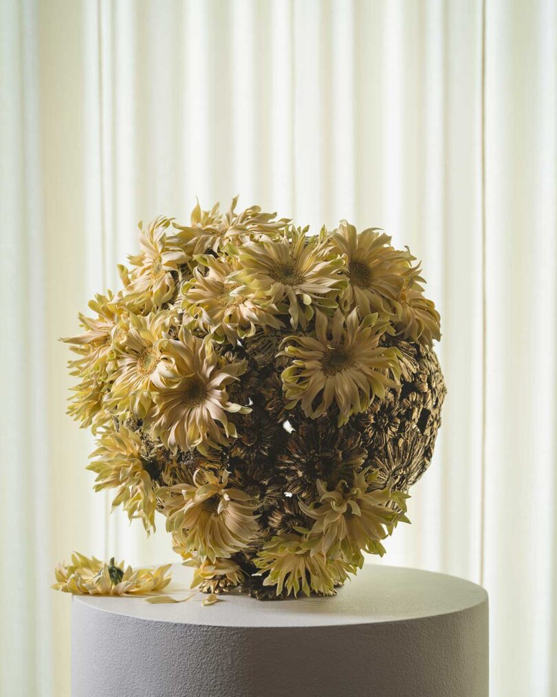 closeup of brass and flower sculptural object
