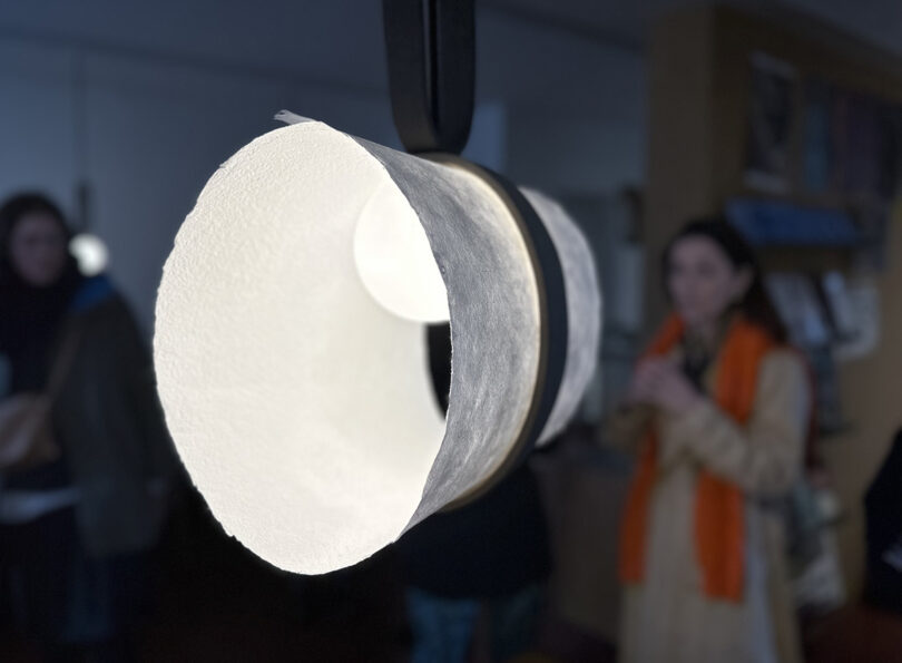 Paper folded into tube and turned into ceiling lamp