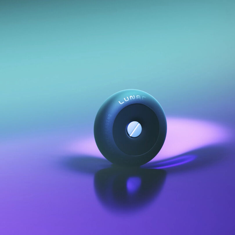 3D illustration of Lunar luggage wheel rolling across an imaginary fluid floor with aqua to purple gradient background.
