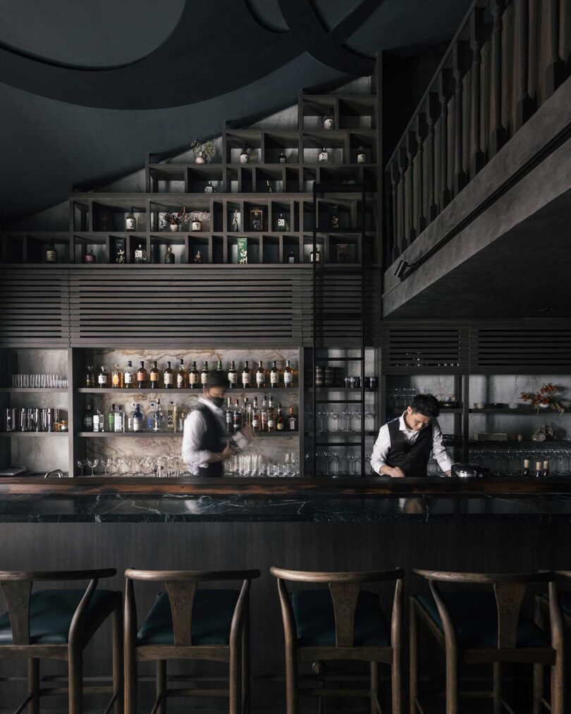 interior shot of modern bar with all black furnishings 