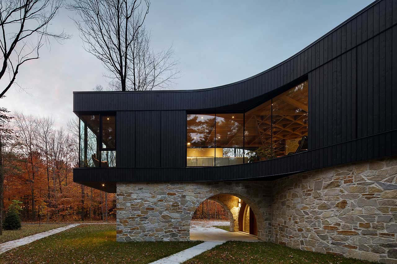 Stone-Clad House Design In The Forest With Open Views Towards The