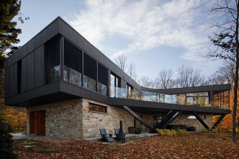 Stone-Clad House Design In The Forest With Open Views Towards The