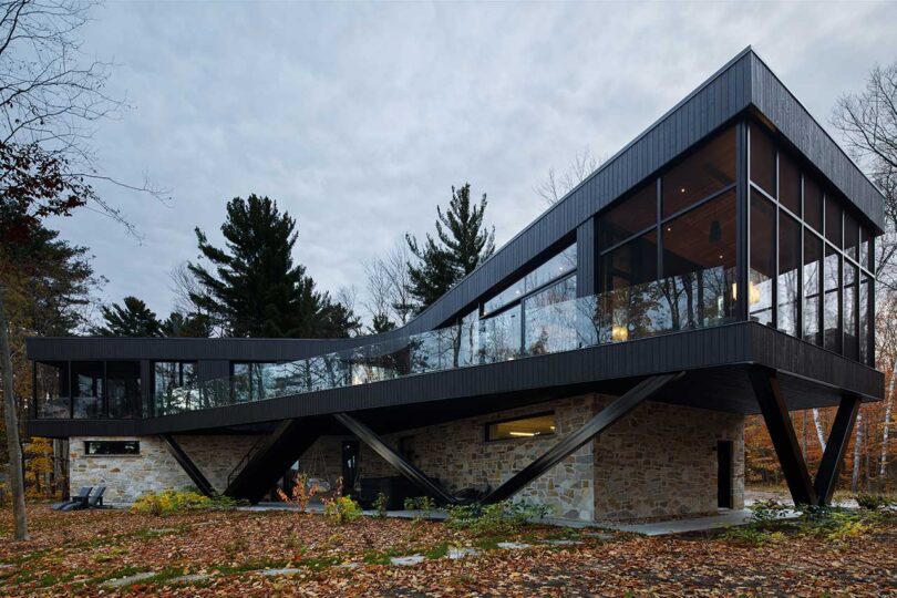 Stone-Clad House Design In The Forest With Open Views Towards The