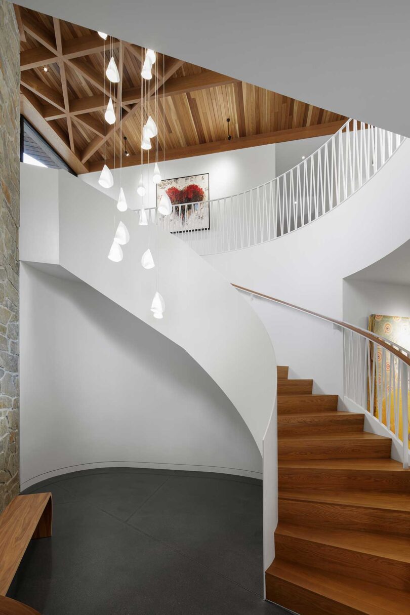 interior view of modern home's circular white and wood staircase