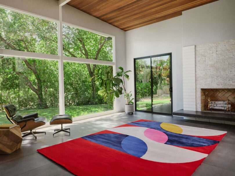 Angled interior view of modern living room with colorful graphic rug