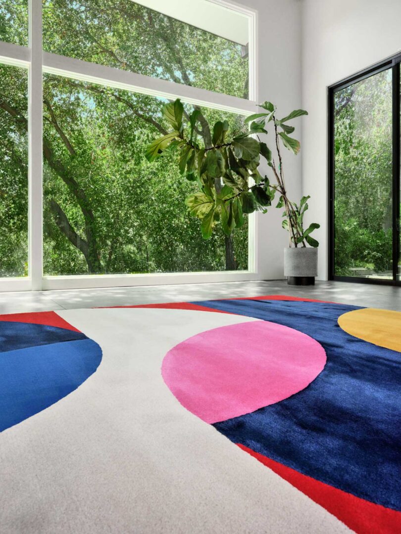 closeup view of bold colorful graphic rug in modern living space