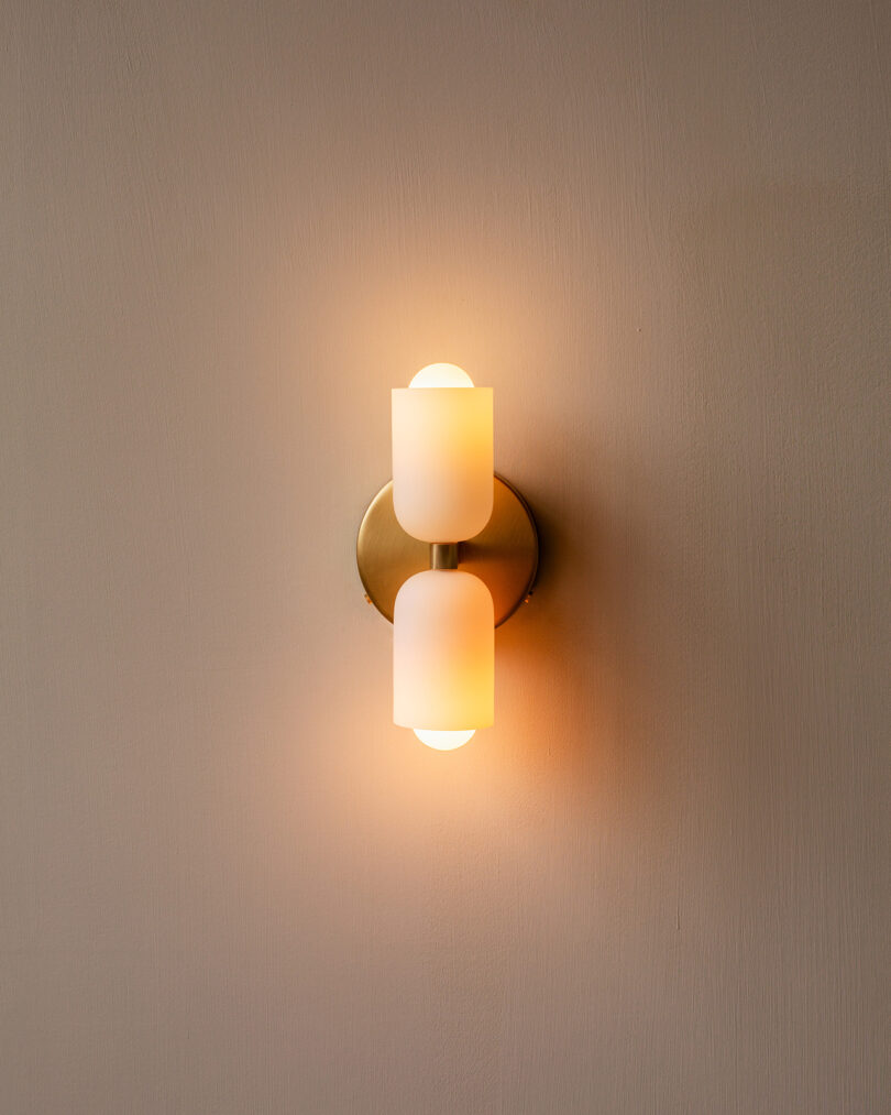 lit double-sided wall sconce