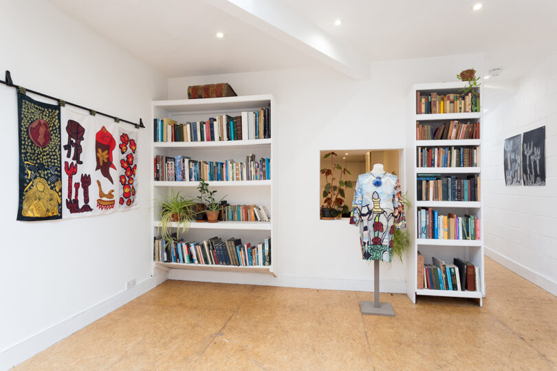 interior space painted white with art and books