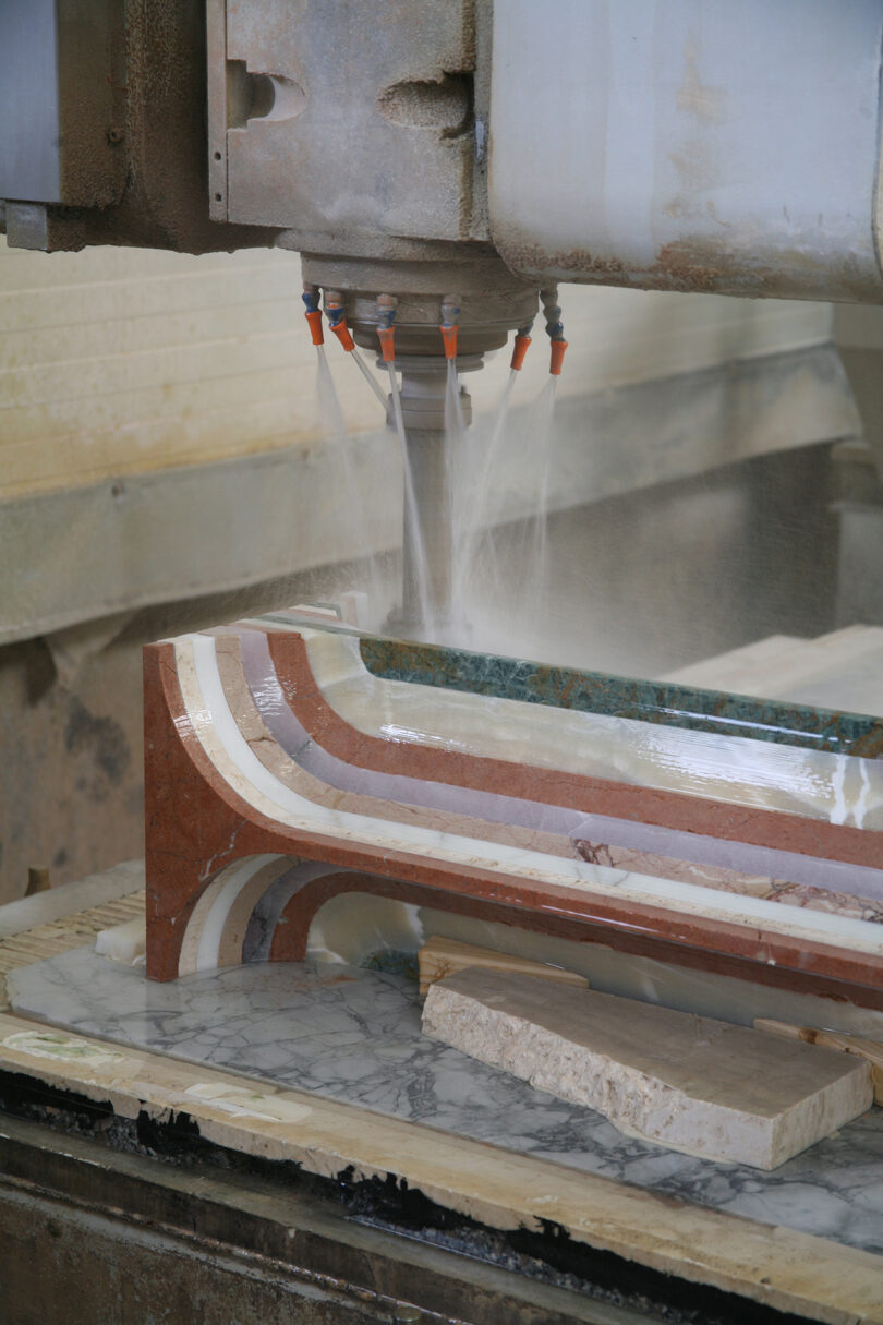 production of furniture made from different colors of marble for a striped effect