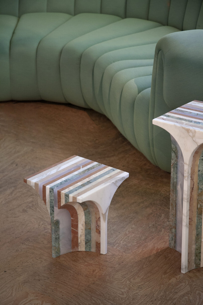 two side tables made from different colors of marble for a striped effect