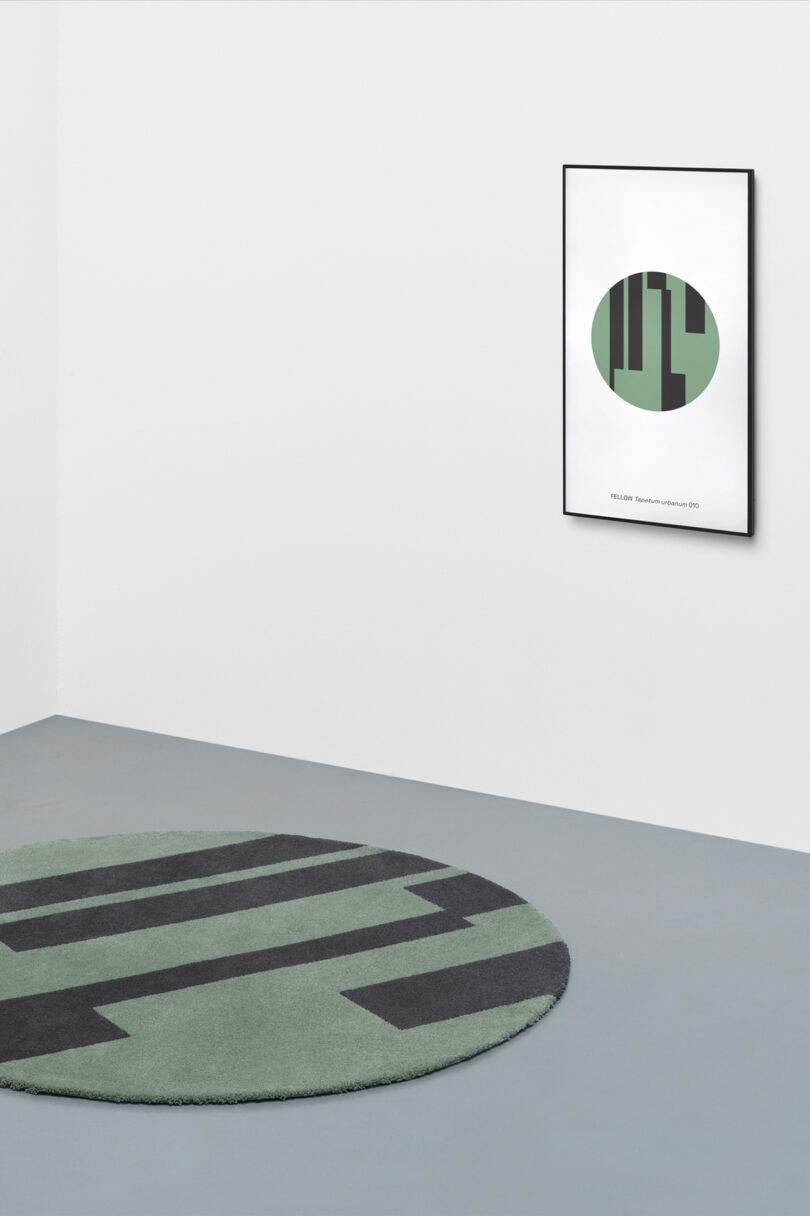 grey-green and black circular rug with matching NFT hanging on wall