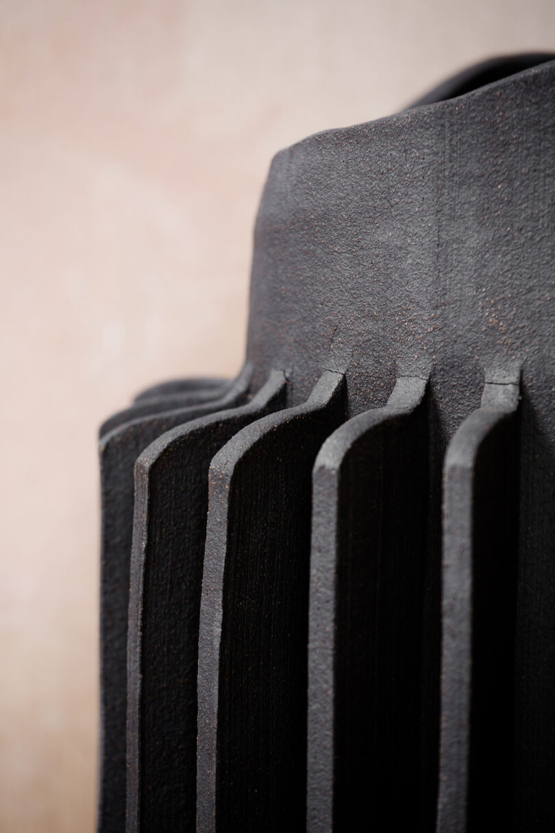 detail of sculptural black vase