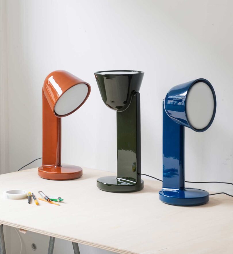 three ceramic lamps lined up at an angle in three colors