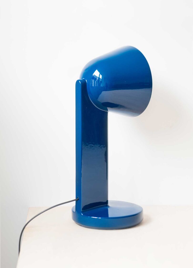 angled back view of blue ceramic lamp