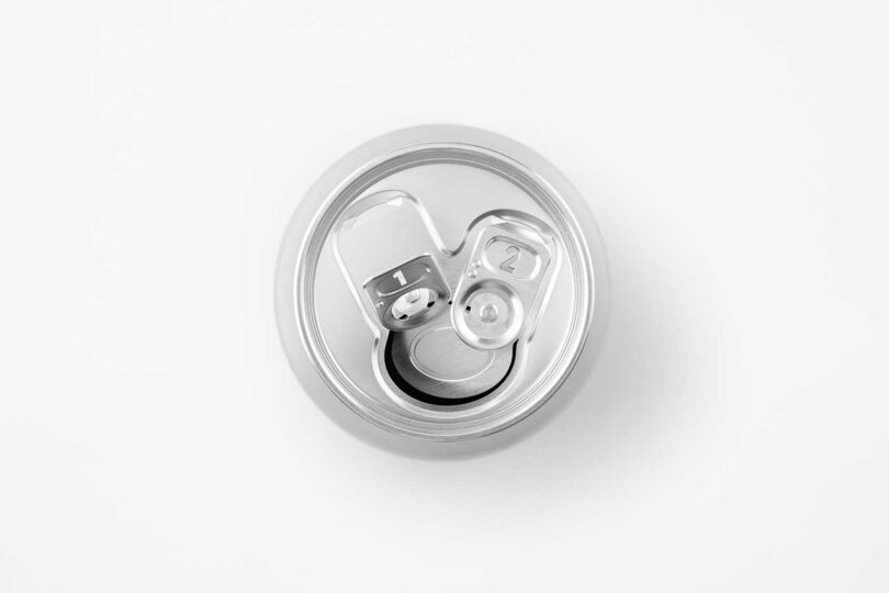 down view of opened chrome beer can with two pull tabs