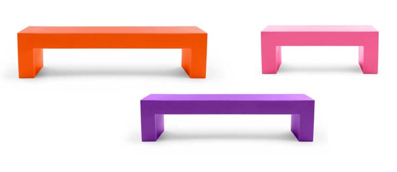 three plastic benches in different colors