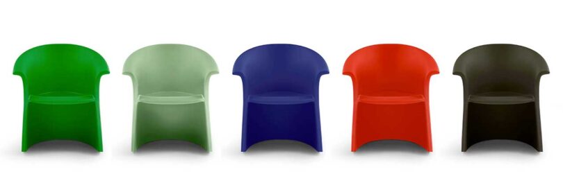 row of five modern plastic rocker chairs in different colors